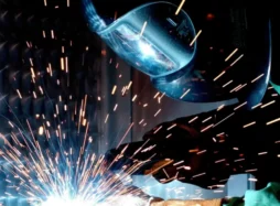 Person wearing mask to protect from sparks: TLD Partnership with Manufacturing Matters Magazine
